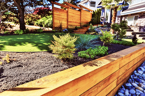wooden retaining wall with a cedar cover